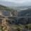 Nysa ancient city ruins on olive-covered hills above Sultanhisar, with a theatre, library, bridge, and gorge