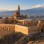 Stone courtyards and domes of İshak Paşa Palace overlooking the mountains near Doğubayazıt