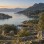 Lake Bafa with granite Latmos mountains, olive trees, and Herakleia ruins at dawn