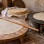 Illustration of thin yufka dough, an oklava rolling pin, and flatbread cooking on a sac griddle.